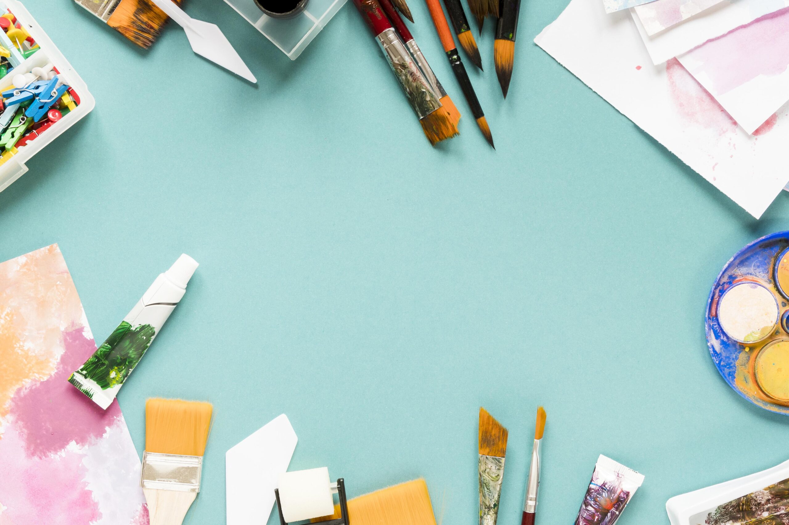 Art supplies arranged on a table.